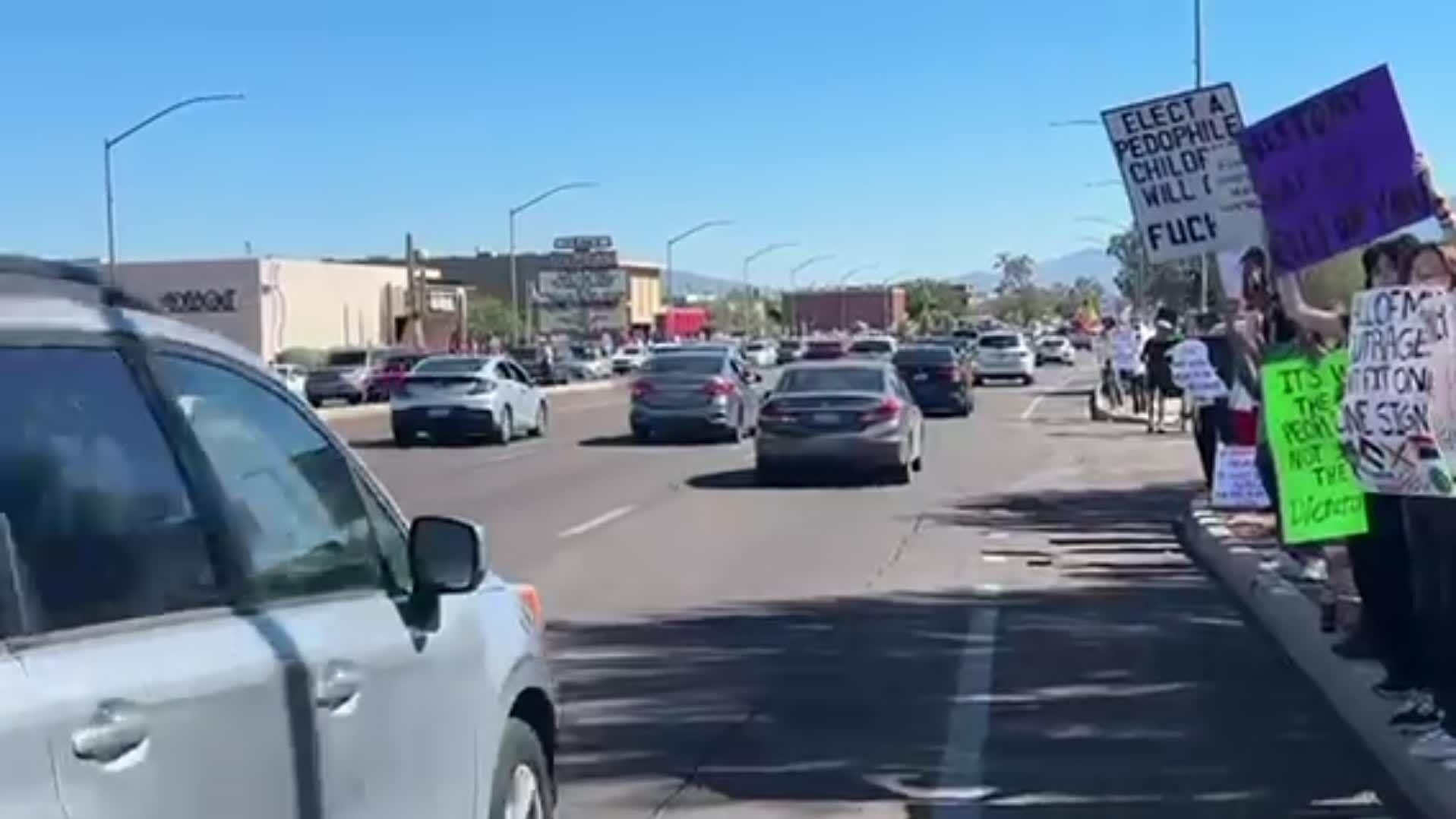 Protestors line the streets of Country Club Rd. and Speedway as part of the nationwide No Kings protests on Saturday, Oct. 18, 2025.